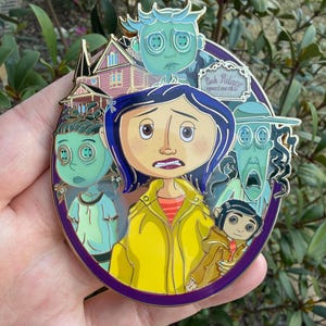 May include: A round, purple enamel pin featuring characters from the animated film, Coraline. The pin includes images of Coraline, the other mother, and other characters. The words "Pink Palace Apartments" are also visible on the pin.