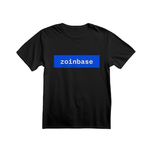 May include: Black t-shirt with a blue rectangular graphic that has the word "zoinbase" in white text. The t-shirt is short-sleeved and appears to be made of a soft material. The design is centered on the front of the shirt.