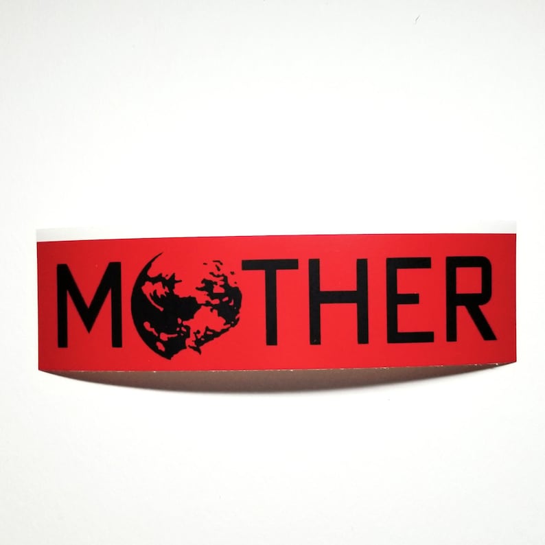 May include: A red sticker with the word "MOTHER" in bold black letters. The letter "O" is replaced with a black graphic of a planet. The sticker has a white border and is set against a white background.