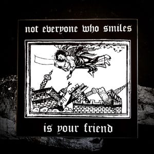 May include: Black and white illustration of an angel falling from the sky, with a city collapsing below. The text "not everyone who smiles is your friend" is written above and below the image.