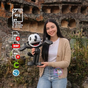 May include: A black, white, and gray geometric papercraft figure of a cartoon cat, with outstretched arms. The figure is 17.7 inches tall, 17.4 inches wide, and 7.8 inches deep. The image also includes the text "#11" and "A4".