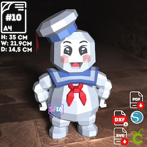 Puede incluir: Una figura de papel de un personaje de dibujos animados, con cuerpo blanco, gorro de marinero azul y pajarita roja. La figura mide 35 cm de alto, 21,9 cm de ancho y 14,5 cm de profundidad. La imagen incluye el texto "#10 A4".