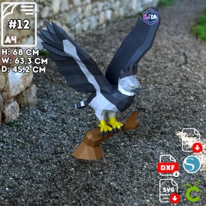 May include: A papercraft eagle with outstretched wings, perched on a brown branch. The eagle is primarily black and white with yellow feet. The dimensions are: Height 26.7 inches, Width 24.9 inches, Depth 17.8 inches. The image includes the text "#12" and "A4".