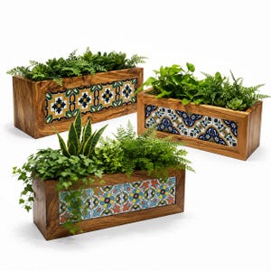 May include: Three rectangular wooden planters with natural grain, each featuring a row of decorative ceramic tiles on the front. The tiles display intricate floral and geometric patterns in blue, yellow, green, and orange, filled with various green plants.