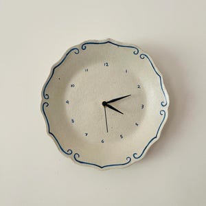 Ceramic clock with blue trim