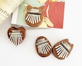 Pocket Kalimba, Mini Thumb Piano, Handmade woodwork, Must-Have for Music Lovers, Fun Decorative Charm,  Bringing Melodic Companionship. product logo