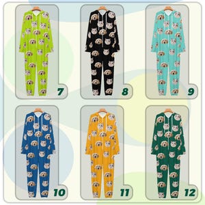 May include: A collection of six hooded onesie pajamas in various colors, each adorned with a repeating pattern of dog faces. Colors include green, black, teal, blue, yellow, and dark green. The pajamas have long sleeves and legs, and a zipper closure.