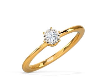 Op de afbeelding: Een eenvoudige gouden ring met een enkele, kleine, ronde diamant gezet in een vier-klauw setting.