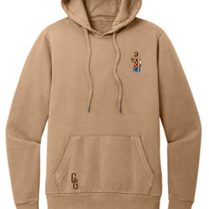 May include: A tan hoodie with a small embroidered image of a hot dog wearing a hat and sunglasses. The hoodie has a kangaroo pocket and the letters "CSU" are embroidered on the pocket.