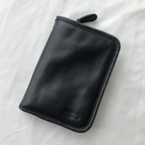 Petit organiseur de portefeuille pochette zippé en cuir noir Coach vintage