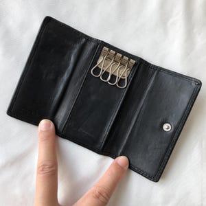 vintage Coach Key Wallet Porte-monnaie en cuir noir à trois volets avec logo C embossé