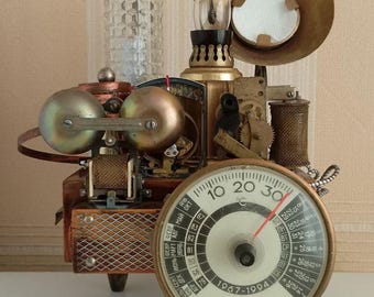 The lamp is made in the steampunk style from vintage components by compiling them into a single art object.