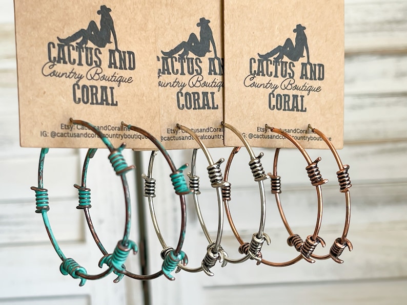 May include: A set of six hoop earrings with barbed wire accents. The hoops are available in turquoise, silver, and copper.