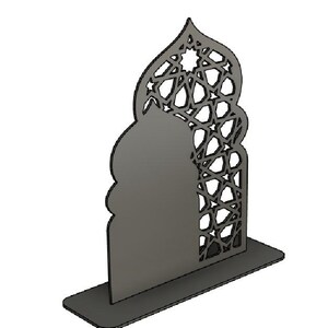 May include: A grey, laser-cut decorative arch with an intricate geometric pattern. The arch is mounted on a rectangular base, creating a freestanding design. The top of the arch features a star-shaped design.
