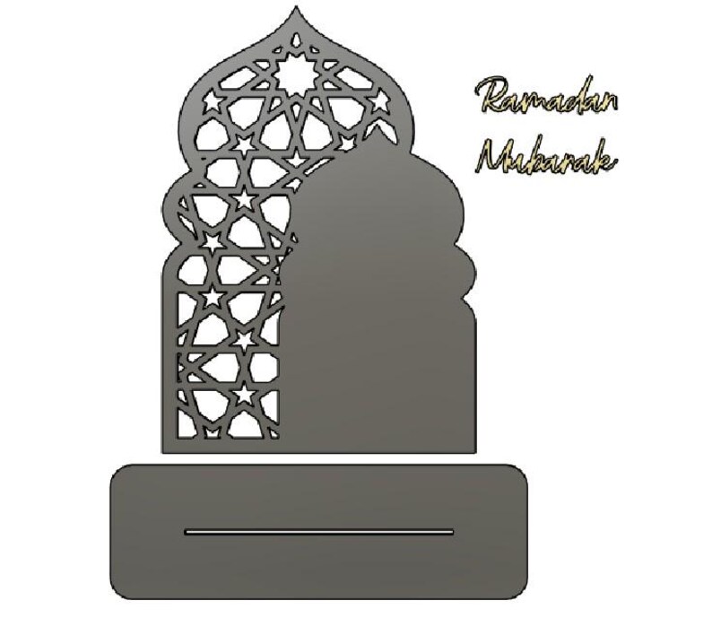 May include: A grey laser-cut Ramadan decoration. The design features an arched silhouette with a star pattern, a solid mosque shape, and a rectangular base with a slot. The words "Ramadan Mubarak" are written in a script font.