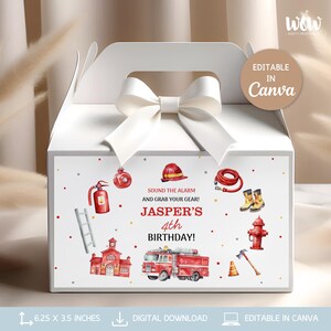 May include: A white party favor box with a white bow and handle. The front features a firefighter theme with illustrations of a fire truck, helmet, and other equipment. Text reads "Sound the alarm and grab your gear! Jasper's 4th Birthday!" The box measures 6.25 x 3.5 inches.