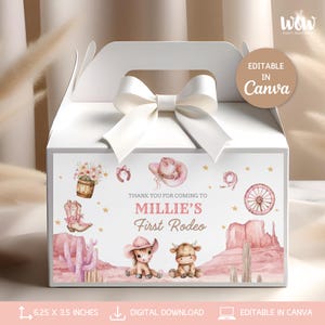 May include: White party favor box with a white bow and handle. The front features a pink and brown design with a cowboy theme, including a cowboy hat, boot, and the text "Millie's First Rodeo." The box measures 15.88 x 8.89 cm.