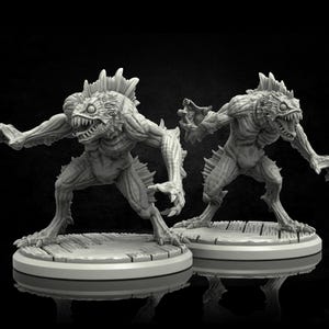 May include: Two grey, detailed, miniature figurines of monstrous, aquatic creatures with sharp teeth and fins. The figures are posed in a dynamic, attacking stance, with one figure facing forward and the other facing to the side. The figures are standing on round, grey bases.