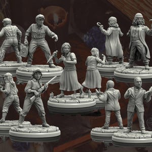 May include: A selection of unpainted miniature figures, each on a circular base. The figures represent different characters, some holding weapons, books, and other objects. The figures are in various poses, suggesting action and storytelling.