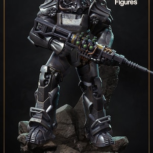 May include: A detailed, grey figure of a character in power armour, holding a futuristic rifle. The figure stands on a rocky base, with the "nom nom Figures" logo in the upper right corner.