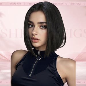 May include: A shoulder-length dark brown bob wig with a centre part. The hair is straight and smooth. The wig is displayed on a person wearing a black sleeveless top with a silver circular zip pull at the neckline. The text Shrine Wigs is visible.