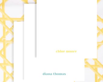 May include: Three white notecards with names in different colors: "chloe moore" in yellow, "diana thomas" in teal, and "hallie jackson" in green. The background features a yellow and white woven pattern.