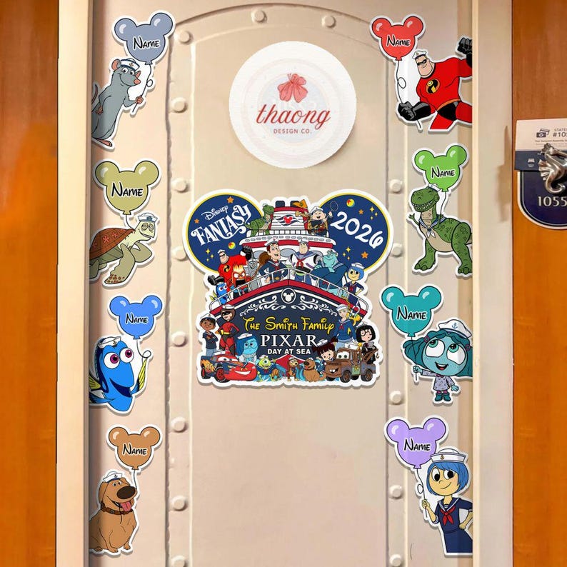 May include: A white door decorated with Disney-themed stickers. The stickers include characters like Dory, Remy, and Mr. Incredible, each holding a balloon with the word "Name." A central sticker reads "Disney Fantasy Pixar Day at Sea 2026."