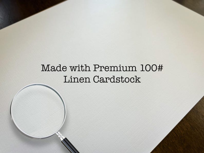 May include: A magnifying glass on a white background with the text "Made with Premium 100# Linen Cardstock".