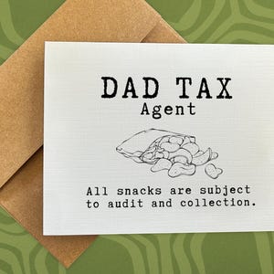 May include: A white card with black text that reads "DAD TAX Agent" and a black and white illustration of a bag of chips. The text below the illustration reads "All snacks are subject to audit and collection."