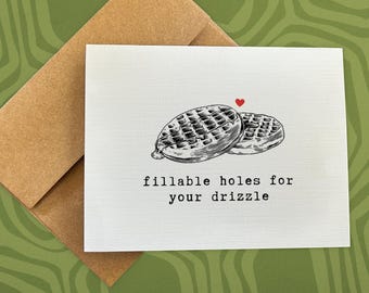 Puede incluir: Una tarjeta blanca con una ilustración en blanco y negro de dos gofres con el texto "fillable holes for your drizzle" impreso en negro.