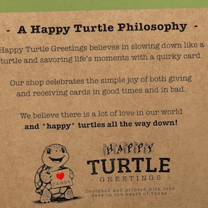 May include: A brown paper card with the text "A Happy Turtle Philosophy" and a drawing of a turtle holding a card that says "CARDS". The text below the drawing says "HAPPY TURTLE - GREETINGS - Designed and printed with love deep in the heart of Texas."