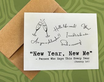 May include: A greeting card with a brown envelope. The card has the text "New Year, New Me" with additional handwritten phrases and champagne glasses. The card is on a green patterned surface.