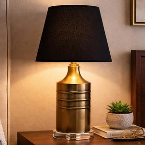 Antique Brass Lamp with a black empire shade on a clear lucite base. 18 inches tall.