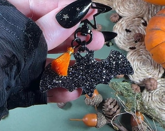 Vleermuistashanger en sleutelhanger. Zwarte glitter portemonnee-bedelaccessoire