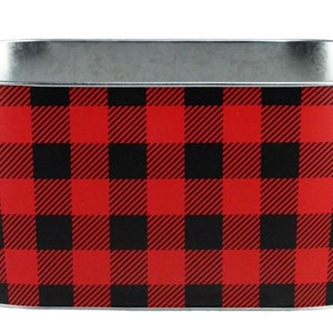 May include: Oval-shaped galvanized metal planter with a red and black buffalo plaid pattern. The planter has a silver rim and a tapered design, suitable for indoor or outdoor use.