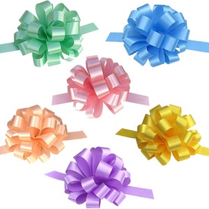 May include: Six pastel-colored gift bows with attached ribbon tails. The bows are in shades of green, blue, pink, orange, purple, and yellow.