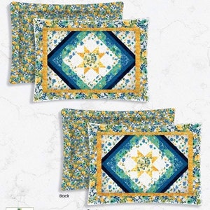 May include: A set of two queen-size pillow shams with a floral pattern on the back and a geometric star pattern on the front. The shams are 36 inches by 26 inches and fit queen-size bed pillows.