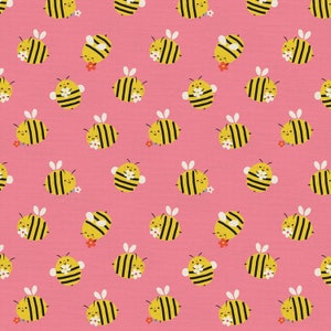 May include: A seamless pattern featuring cute cartoon bees with yellow and black stripes on a pink background. The bees are holding flowers and have smiling faces.