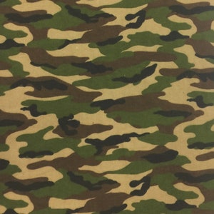 May include: Camouflage pattern featuring a mix of green, brown, and black irregular shapes on a tan background. The design is a classic military-inspired print, suitable for various applications.