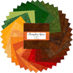 May include: A stack of square fabric swatches arranged in a circular fan pattern, featuring shades of green, yellow, orange, red, and brown with various tonal patterns. An orange paper band labeled Pumpkin Spice 5 Karat Gems wraps the center.