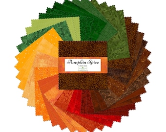 May include: A stack of square fabric swatches arranged in a circular fan pattern, featuring shades of green, yellow, orange, red, and brown with various tonal patterns. An orange paper band labeled Pumpkin Spice 5 Karat Gems wraps the center.