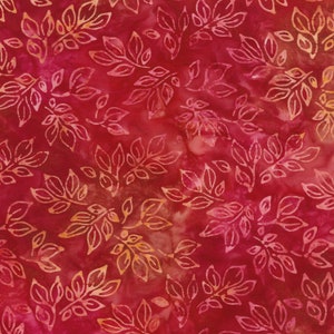 May include: Red fabric with a repeating pattern of orange leaves. The leaves are stylized and have a batik-like appearance.