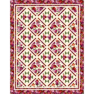 May include: A quilt with a geometric pattern of red, white, and green triangles. The background is a cream color with a floral print of pink and purple roses.