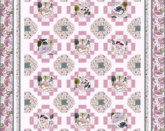 May include: A pink and white quilt with a repeating pattern of a woodland scene with a deer, a bird, and a tree. The quilt is surrounded by a pink and green border.
