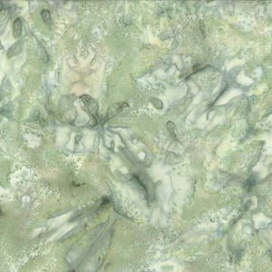 May include: A piece of fabric featuring a mottled, abstract pattern in shades of sage green, pale mint, and off-white. The surface displays a textured, watercolor-like effect with blended organic shapes and soft, diffused color transitions.