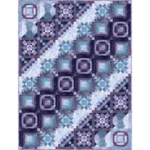 May include: A quilt with a geometric pattern in shades of blue and purple. The quilt is made up of squares and triangles, and the colors are arranged in a diagonal pattern.