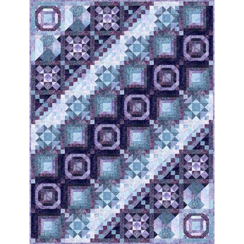 May include: A quilt with a geometric pattern in shades of blue and purple. The quilt is made up of squares and triangles, and the colors are arranged in a diagonal pattern.