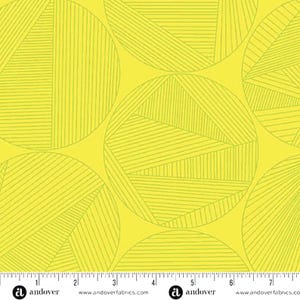 May include: A seamless fabric pattern featuring large, overlapping circles in a bright yellow hue. Each circle is segmented with thin, parallel lines in a lighter shade of yellow, creating a geometric design. The fabric has a ruler along the bottom edge.