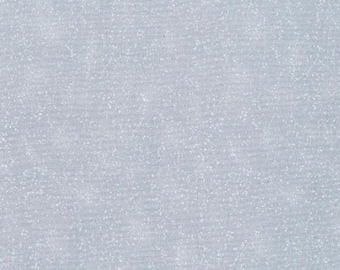 May include: A close-up of a light blue fabric with a subtle, textured pattern. The fabric has a slightly shimmering appearance, with tiny white specks scattered across the surface. The overall effect is soft and delicate.
