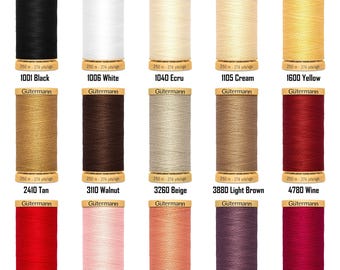 May include: A collection of Gütermann thread spools in various colors, including black, white, ecru, cream, yellow, tan, walnut, beige, light brown, wine, red, pink, light rose, light plum, and magenta. Each spool is labeled with a color code and contains 250 meters (274 yards) of thread.